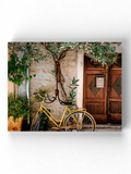 Yellow Bicycle Parked Wrapped Canvas -Image by Shutterstock - WhatYouNeedSales